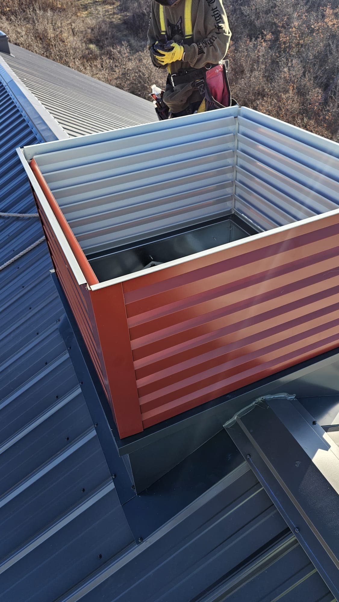 Roof detail showing noncombustible flashing and fire-rated assembly work