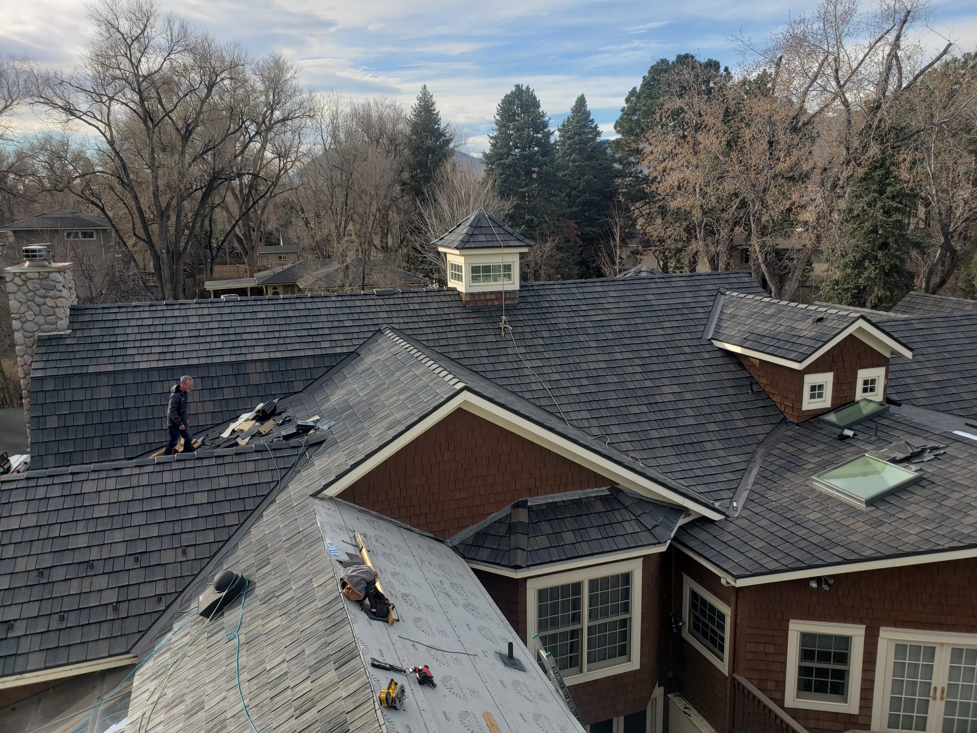 Asphalt shingle roof replacement in progress on a Colorado home